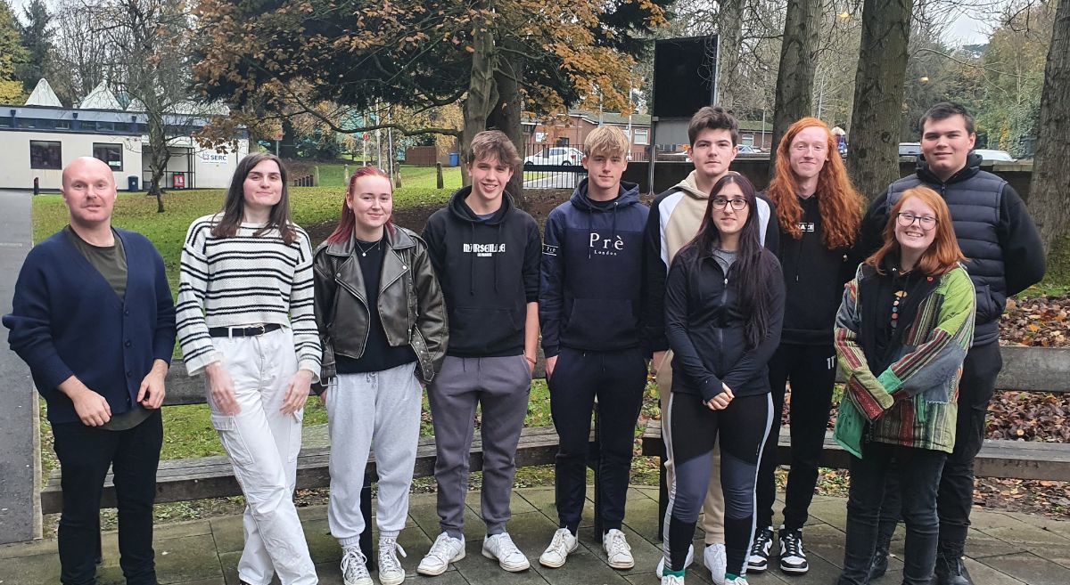 Lecturer Irwin Pryce and ten students pictured outside SERC's Bangor Campus